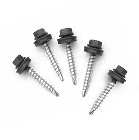 Metal screws lying on the surface with white background